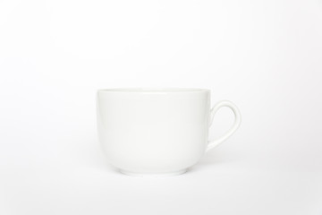 White tea cup isolated on white background side view with handle.