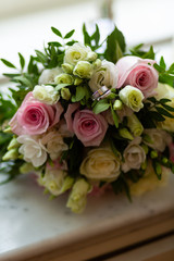 Wedding rings with wedding bouquet