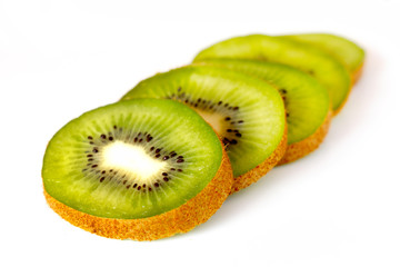 Kiwi slices on white isolated background, tropical fruits_