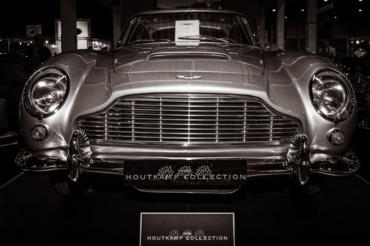 MAASTRICHT, NETHERLANDS - JANUARY 08, 2015: The luxury grand tourer car Aston Martin DB5, 1964. Stylization. Toning. International Exhibition InterClassics & Topmobiel 2015