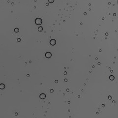 Rain water drops  on clear window.  Natural Pattern of raindrops. Autumn  depressive background..