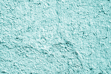Fototapeta na wymiar Painted cement wall background in cyan color.