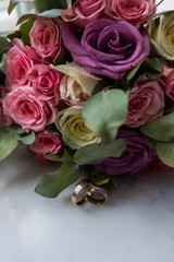 Wedding rings with wedding bouquet