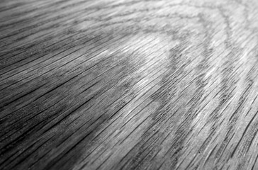Wooden board texture with blur effect in black and white.