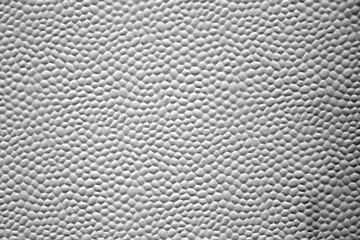Bubbled metal sheet texture in black and white.