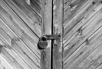 Wooden door with lock in black and white.