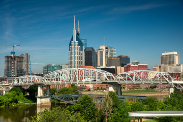 City of Nashville Tennessee and the John Seigenthaler Pedestrian Bridge on the Cumberland River in Tennessee USA