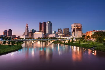 Fotobehang Downtown cityscape looking over the Scioto River and the Discovery Bridge along the Riverfront Park in the city of Columbus Ohio USA © Aevan
