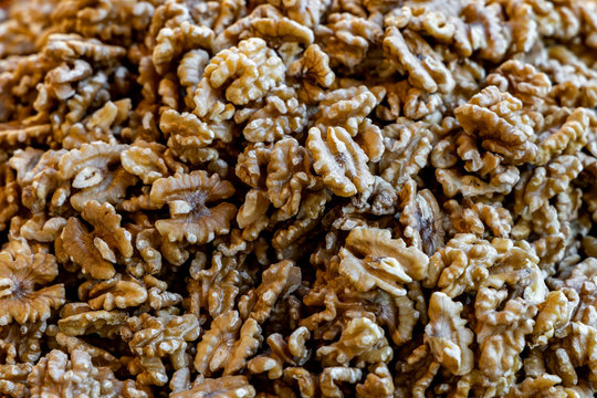 Walnuts shelled. Peeled raw walnuts. Fresh organic nuts. Raw nuts.  Walnuts as a food background.