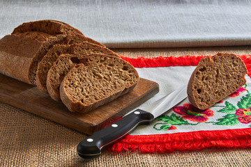 bread and wheat on wooden table