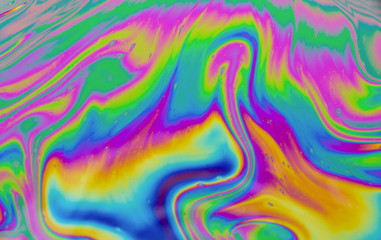 Psychedelic abstract background. Photo macro shot with light interference on the surface of a soap bubble