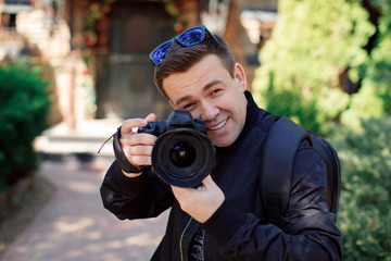 photographer in sunglasses and black clothes 