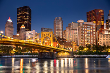 City skyline view over the Allegheny River and Roberto Clemente Bridge in downtown Pittsburgh Pennsylvania USA