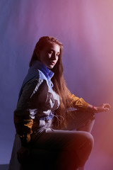 Teen girl in stylish clothes. Trend photos in 90s style. Toning photos with highlights.