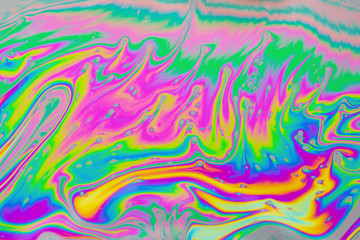 Psychedelic multicolored patterns background. Photo macro shot of soap bubbles
