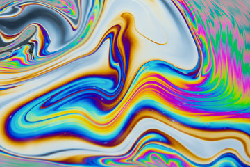Psychedelic abstract background. Photo macro shot with light interference on the surface of a soap...