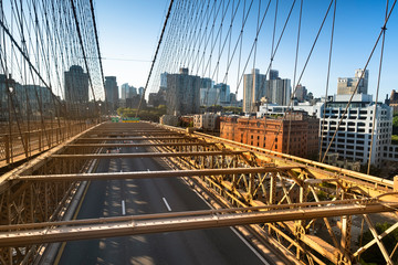 Traffic moves across the Brooklyn Bridge connecting Manhattan New York City over the East River