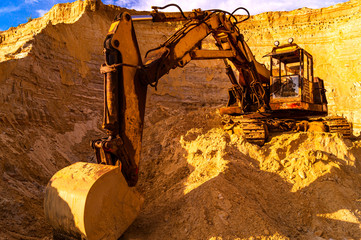 Sand mining concept - quarry sand excavator with heavy machinery -  Construction industry - Old...
