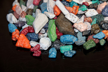 Sweet colored stones on a black background.