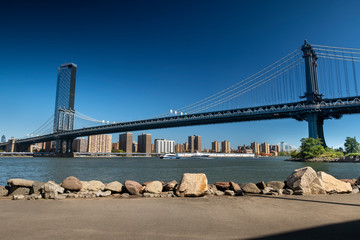 Manhattan Bridge as seen from the DUMBO area and Pebble Beach in Brooklyn New York USA