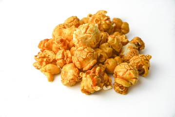 Caramel pop corn on white background