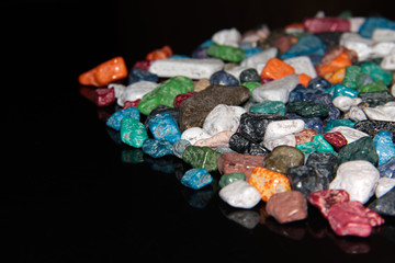 Sweet colored stones on a black background.