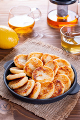 Cottage cheese pancakes with honey, vertical