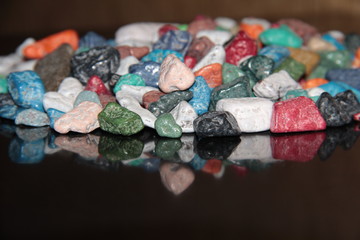 Reflection of the candy on the table. Chocolate in the form of rubble.