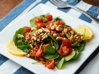 Winter purslane salad with tomatoes and toasted walnuts