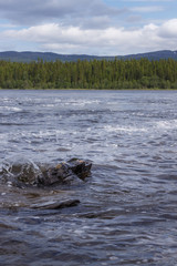 View of the hills and Våmviken lake near the waterfall