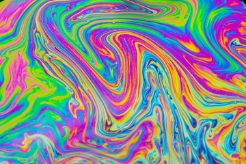 Psychedelic multicolored patterns background. Photo macro shot of soap bubbles