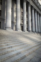 Exterior view of the steps and columns leading into a federal courthouse