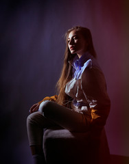 Teen girl in stylish clothes. Trend photos in 90s style. Toning photos with highlights.
