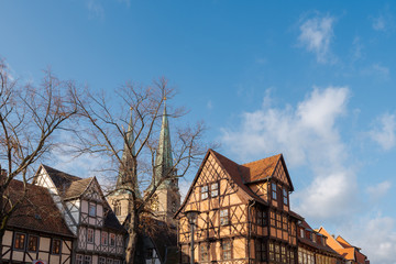 Old half-timbered houses in Quedlinburg, Germany on sunny day with clouds