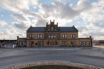 Fototapeta na wymiar Train station building in Quedlinburg, Germany on sunny day with clouds