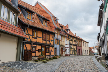 Old half-timbered houses in Quedlinburg, Germany on sunny day with clouds