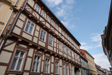 Old half-timbered houses in Quedlinburg, Germany on sunny day with clouds