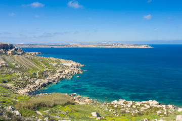 Naklejka premium Aerial drone view of rocky coastline and sea. Malta