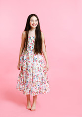 Portrait of adorable smiling little girl child in dress isolated