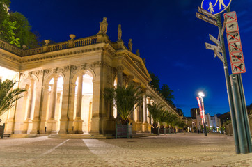 The Mill Colonnade Mlynska kolonada Neo-Renaissance building with columns and hot springs in spa town Karlovy Vary Carlsbad historical city centre, night evening view, West Bohemia, Czech Republic