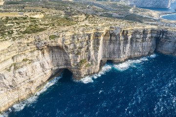 Aerial view of Sea Tunnel near Azure window. Dwejra is a lagoon of seawater on the Gozo island.Malta