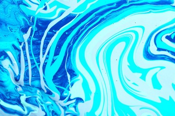 Abstract blue and white background. Game of colors. Acrylic texture with marble pattern. Wallpaper, mixing, modern art.