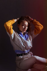 Teen girl in stylish clothes. Trend photos in 90s style. Toning photos with highlights.