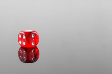 Red dice and reflection