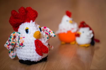 Symbol of the year 2017, the year of the rooster. Knitted cock, isolate. Textile decoration for interior design or Christmas tree. Perfect for a gift.
