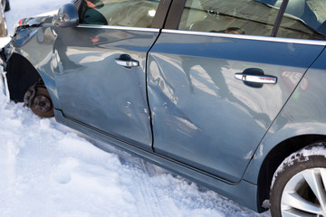 Sheet metal damage to blue car. Traffic Accident