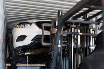 Unloading the car from the container