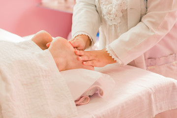 Foot massage therapy, with specialized professional