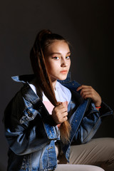 Teen girl in stylish clothes. Trend photos in 90s style. Toning photos with highlights.