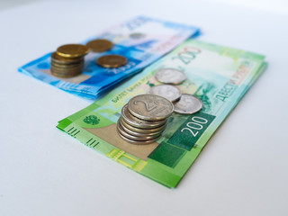 Russian rouble. Money concept. Two thousand and two hundred rubles. Coins of the Bank of Russia. Close up